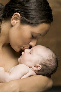 WHY MOTHERS KISS THEIR BABIES